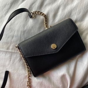 Black Michael Kore crossbody with gold chain